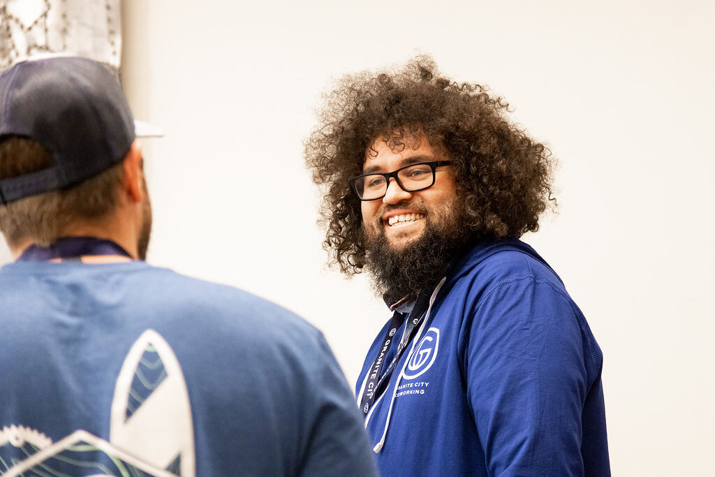 Two members laughing during a candid moment at a Granite City community event