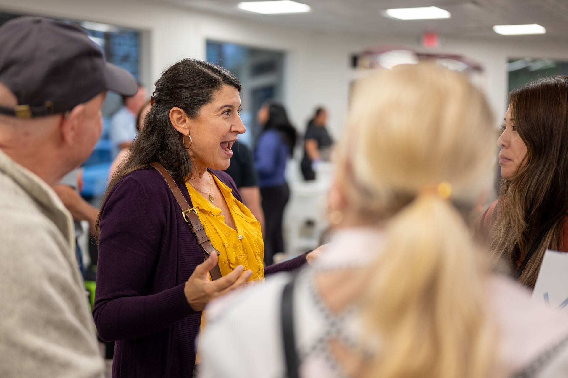 Animated conversation between guests during a Granite City community event